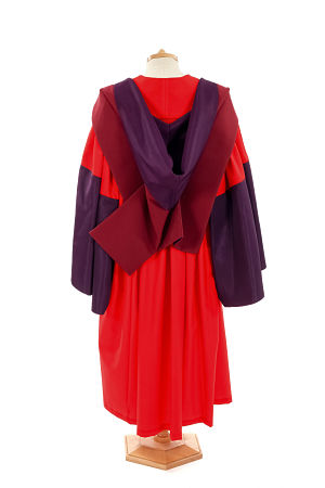 The back of a PhD degree gown, hanging on a clothes stand.